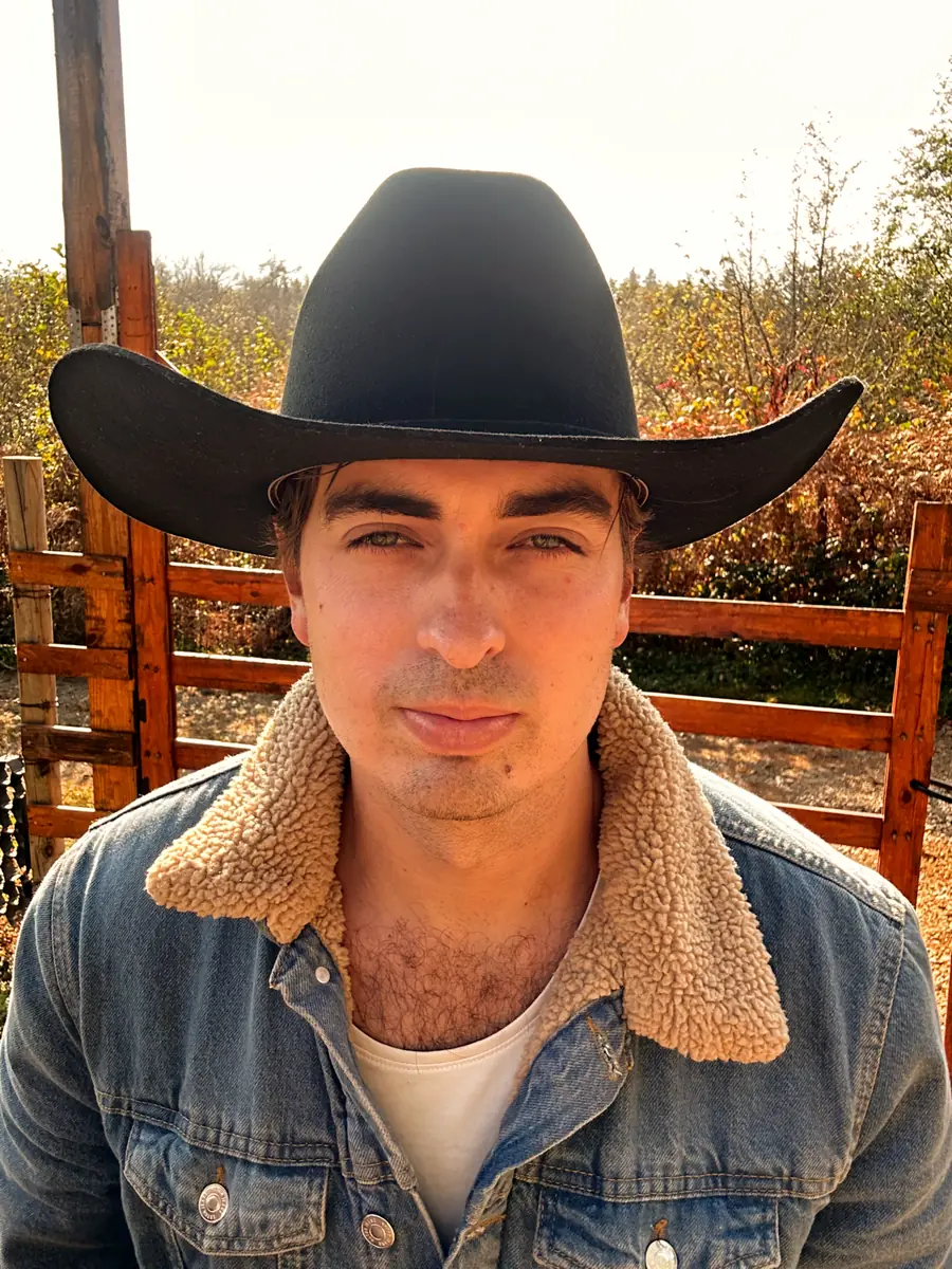 Estevan Knox in a black cowboy hat